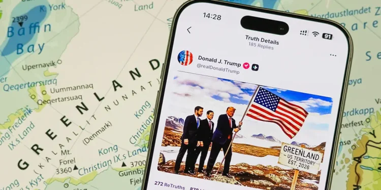 Smartphone Displays Donald Trump Post on Truth Social About Greenland