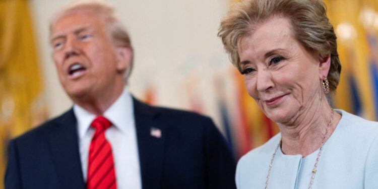 FILE PHOTO: U.S. President Donald Trump signs an executive order to shut down the Department of Education