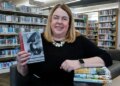 Julie Wendorf, director of the Crown Point Community Library and president of the Indiana Library Federation, discussed some of the books that have been challenged, including controversial titles stolen from the shelves and attempts to censor titles by legislation. Wendorf is shown at the Crown Point Community Library on Friday, Feb. 21, 2025. (John Smierciak / Post-Tribune)
