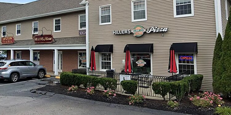 beige building with hillers pizza sign
