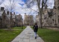 A Yale student walks through campus.