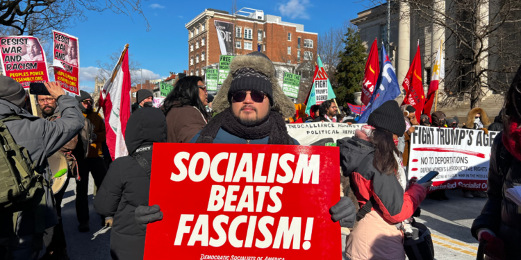 In an anti-Trump march, Democratic Socialists of America members carried signs against "fascism."