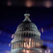 FILE PHOTO: The U.S. Capitol dome is seen reflected in a puddle in Washington