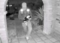 A view from a doorbell camera showing an armed individual outside the residence of Nancy Guthrie in Tucson, Arizona