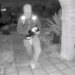 A view from a doorbell camera showing an armed individual outside the residence of Nancy Guthrie in Tucson, Arizona