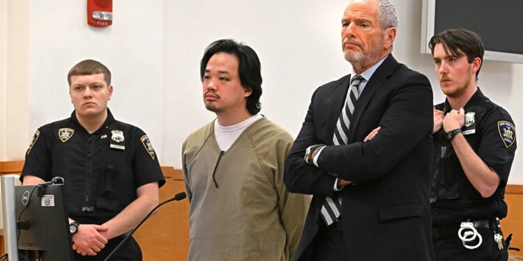 Jeopardy contestant Winston Nguyen standing in a courtroom with a visible bruise under his eye.