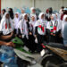 Women in solidarity with Palestinians take part in a protest outside the Palestinian Embassy in Jakarta
