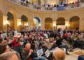 Hundreds of people attend a rally in the rotunda of the Minnesota State Capitol.