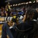 12-year-old Myles Minishotta works as a photographer at this week's Central Intercollegiate Athletic Association men's and women's basketball tournaments at CFG Bank Arena in Baltimore. (Kenneth K. Lam/Staff)