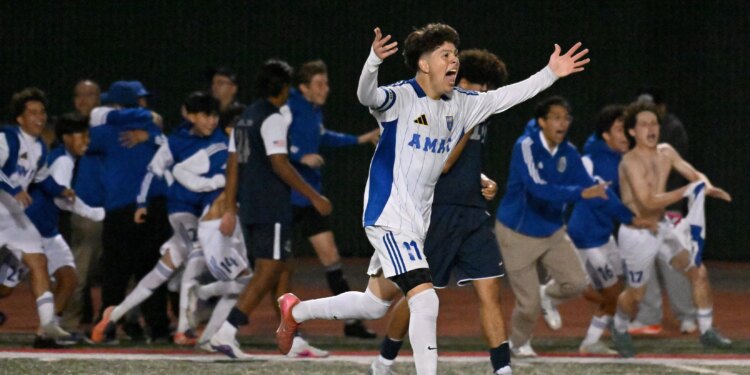 Bishop Amat players celebrate their 2-1 win against Newport Harbor...