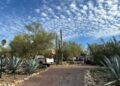Law enforcement officers are present outside the home of Nancy Guthrie, the mother of "Today" host Savannah Guthrie, near Tucson, Ariz., Monday, Feb. 2, 2026.