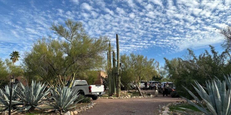 Law enforcement officers are present outside the home of Nancy Guthrie, the mother of "Today" host Savannah Guthrie, near Tucson, Ariz., Monday, Feb. 2, 2026.