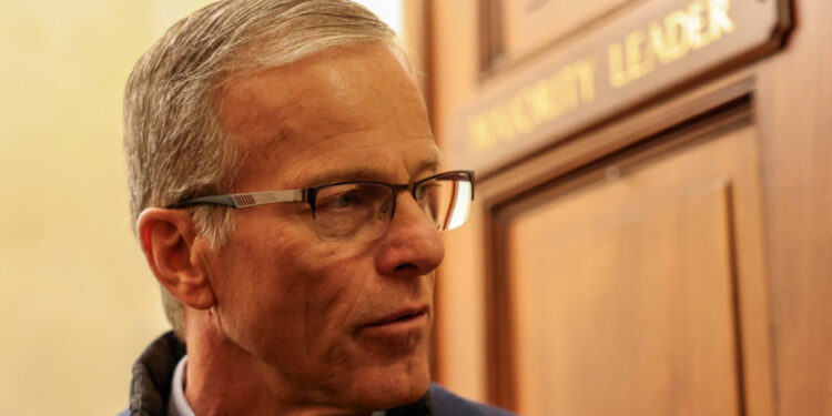 John Thune speaks with reporters following Senate votes regarding a dispute over immigration enforcement, and with a parti...