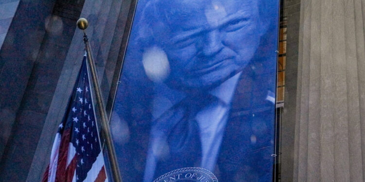 New banner depicting U.S. President Donald Trump is put up on the Department of Justice building in Washington, D.C.