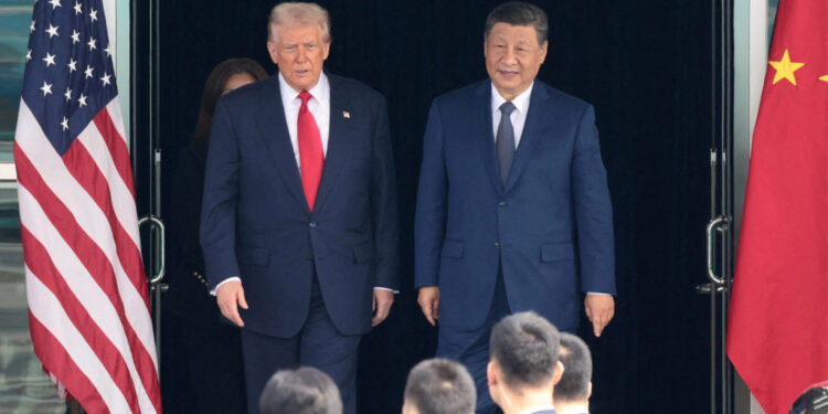 FILE PHOTO: U.S. President Donald Trump meets with Chinese President Xi Jinping on the sidelines of the APEC summit, in Busan