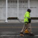 A worker walks in front of the recently renamed Donald J. Trump and John F. Kennedy Memorial Center for the Performing Art...