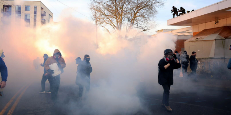Federal agents lobbed tear gas and flash bangs at protesters