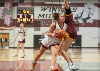 Cielo Balsamo drives the lane during a playoff basketball game...
