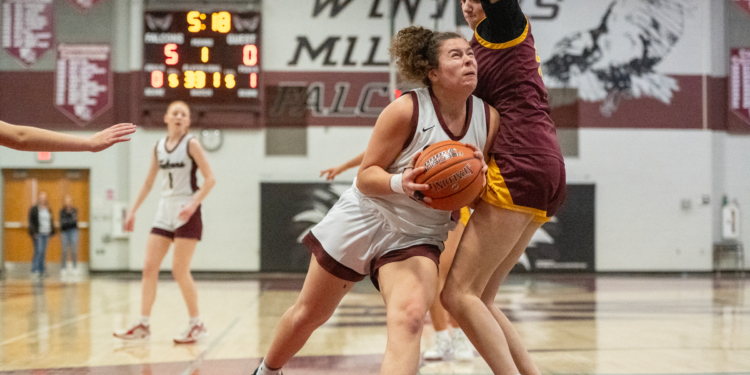 Cielo Balsamo drives the lane during a playoff basketball game...