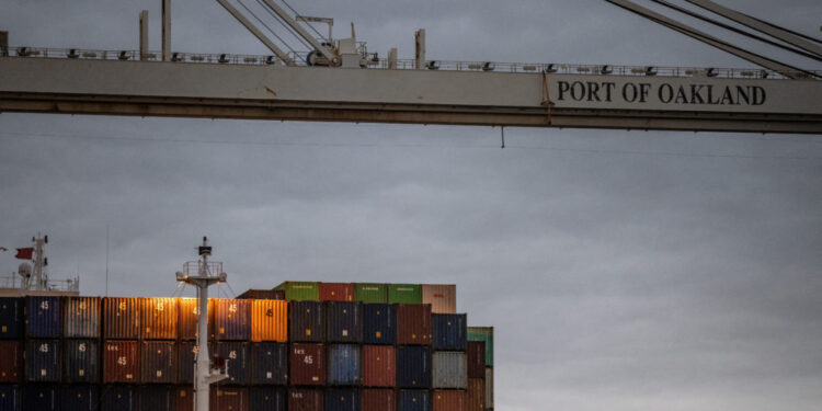 Shipping containers at the port of Oakland , California