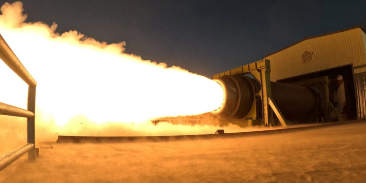 North Korea's Kim Jong Un observes a ground ejection test of a high-output solid-fuel engine using carbon fiber composite ...