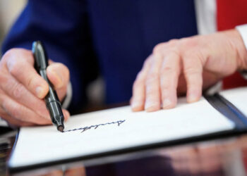 FILE PHOTO: U.S. President Donald Trump signs executive orders at the White House