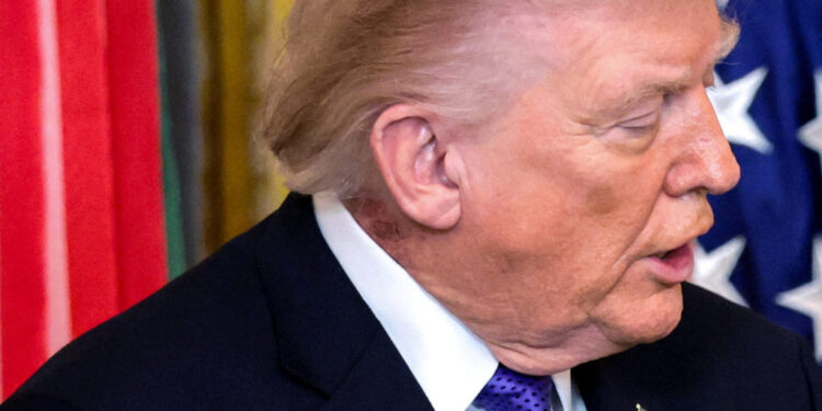 FILE PHOTO: A patch of blemished skin is visible on U.S. President Trump’s neck at the White House in Washington