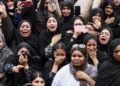 Mourners cry during a funeral for children killed in a reported strike on a primary school in Minab, Iran, on March 3, 2026.