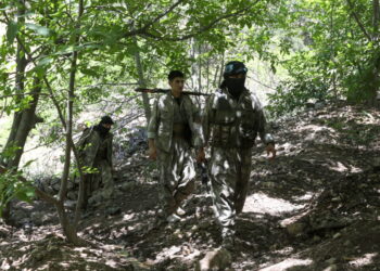 Fighters from the Kurdistan Free Life Party (PJAK), an Iranian Kurdish opposition group, are pictured near the border with...
