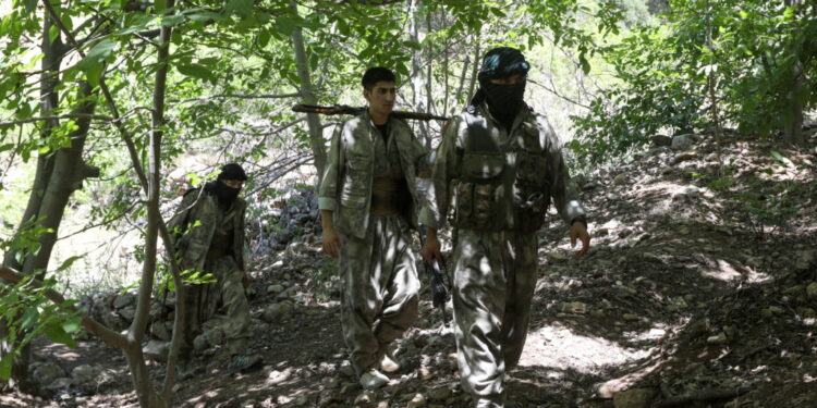 Fighters from the Kurdistan Free Life Party (PJAK), an Iranian Kurdish opposition group, are pictured near the border with...