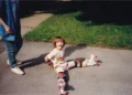 The author learning to roller skate as a child.