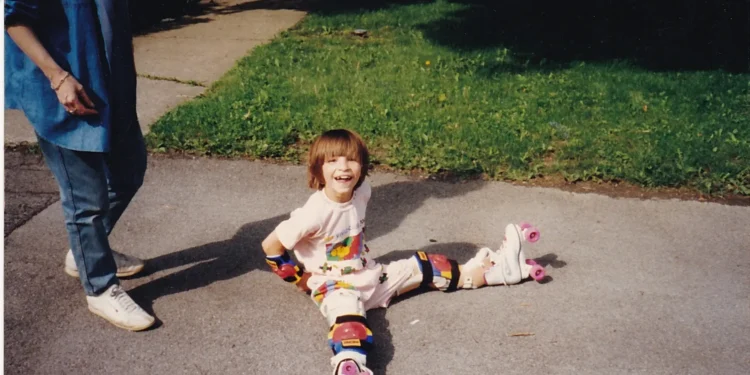 The author learning to roller skate as a child.
