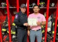 fire department honors Perez-Glass with certificate.