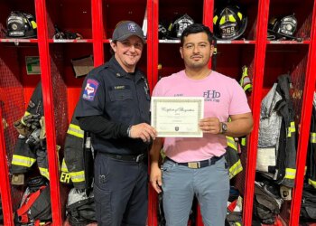 fire department honors Perez-Glass with certificate.
