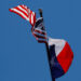 FILE PHOTO: The U.S flag and the Texas State flag fly over the Texas State Capitol in Austin