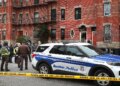 Boston Police and investigators are at a brownstone