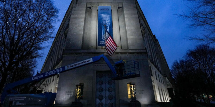 New banner depicting U.S. President Donald Trump is put up on the Department of Justice building in Washington, D.C.