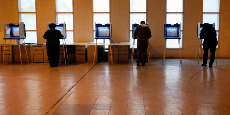 Voters cast their ballots at a polling station in Providence