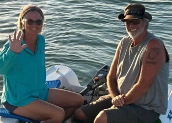 Brian and Lynette Hooker on dinghy