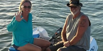 Brian and Lynette Hooker on dinghy
