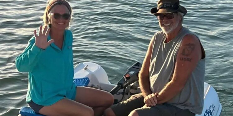 Brian and Lynette Hooker on dinghy