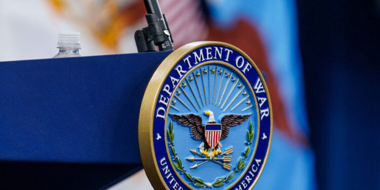 A seal for the Department of War on the podium at the Pentagon