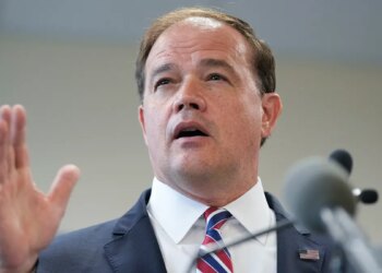 Suffolk County District Attorney Ray Tierney speaking to reporters at a news conference