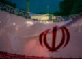 Demonstrators protest against military action in Iran after U.S. President Donald Trump said that he had agreed to a two-w...