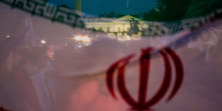 Demonstrators protest against military action in Iran after U.S. President Donald Trump said that he had agreed to a two-w...