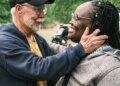 Jimmy Dorrell greets longtime attendees and friends of Church Under the Bridge during his final service as pastor on Easter Sunday.