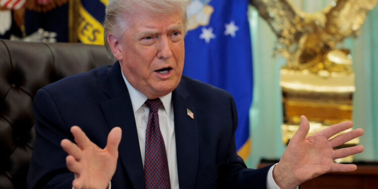 U.S. President Trump signs an executive order in the Oval Office of the White House