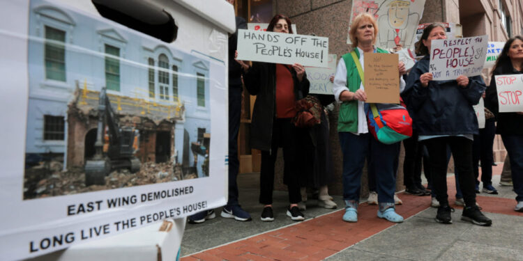 Anti-Trump activists gather before the National Capital Planning Commission meets to deliberate about the Trump White Hous...