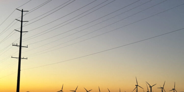 Wind turbines are show at sunrise in Palm Springs, California