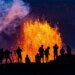 People watch as Hawaii's Kilauea Volcano erupts